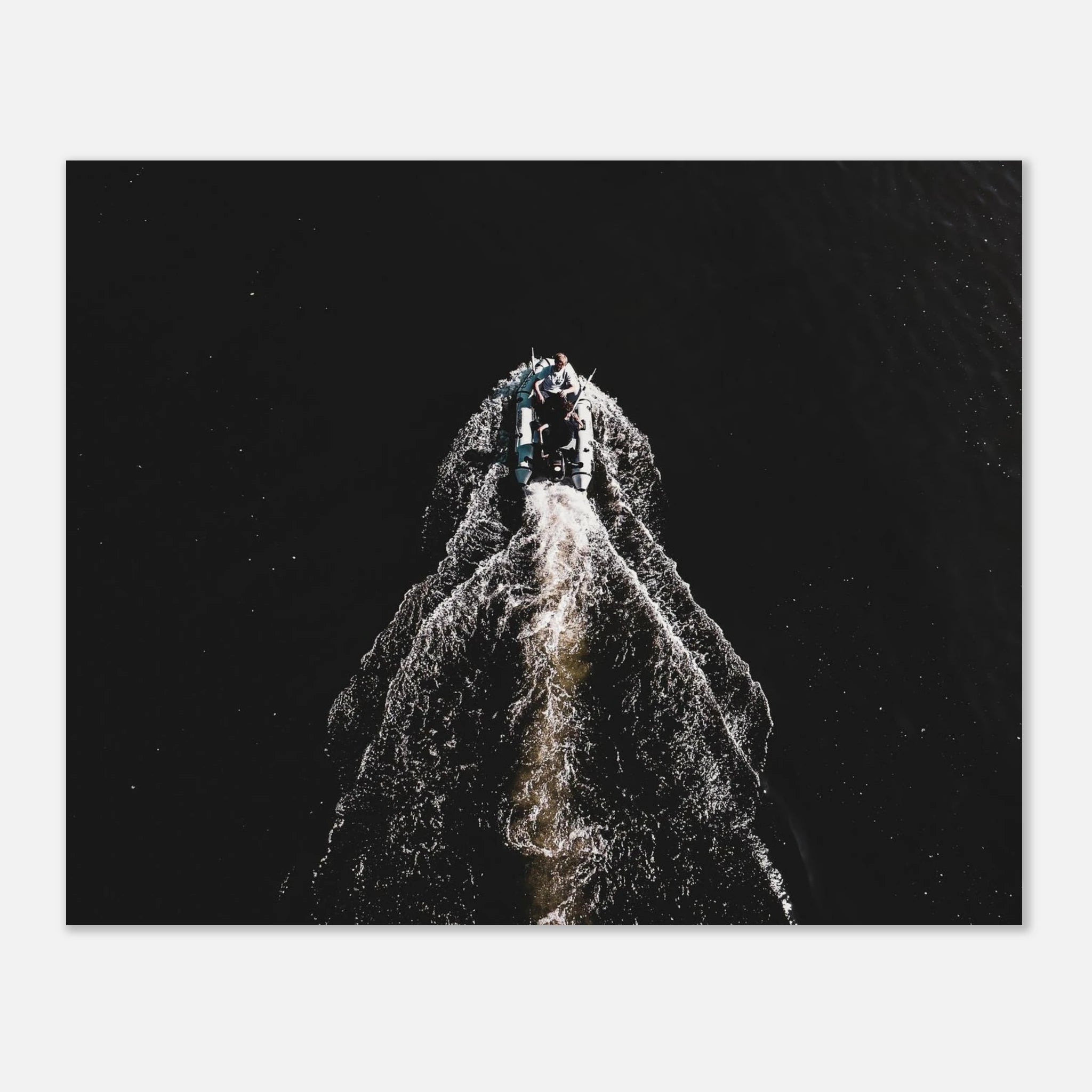 Aerial drone photo of a speedboat cutting a white trail across dark water, boat and sea adventure poster