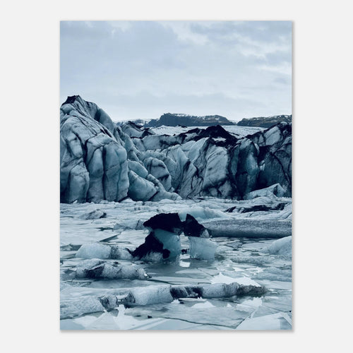 Jagged blue glacier ice shapes over a frozen lagoon in Iceland, cool blue landscape wall art poster