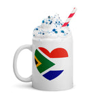 White glossy ceramic mug featuring a heart design that combines the South African and Dutch flags, South African Roots collection mug for proud expats in the Netherlands.