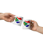 White glossy ceramic mug featuring a heart design that combines the South African and Dutch flags, South African Roots collection mug for proud expats in the Netherlands.