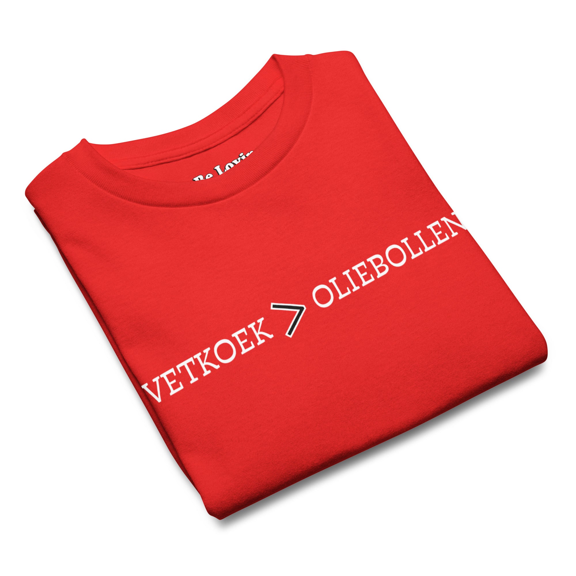 Red kids t-shirt with the text “Vetkoek > Oliebollen” printed across the chest, South African Roots youth tee.