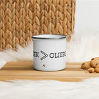 White enamel camping mug with silver rim and wraparound black “Vetkoek > Oliebollen” text, part of the South African Roots collection.