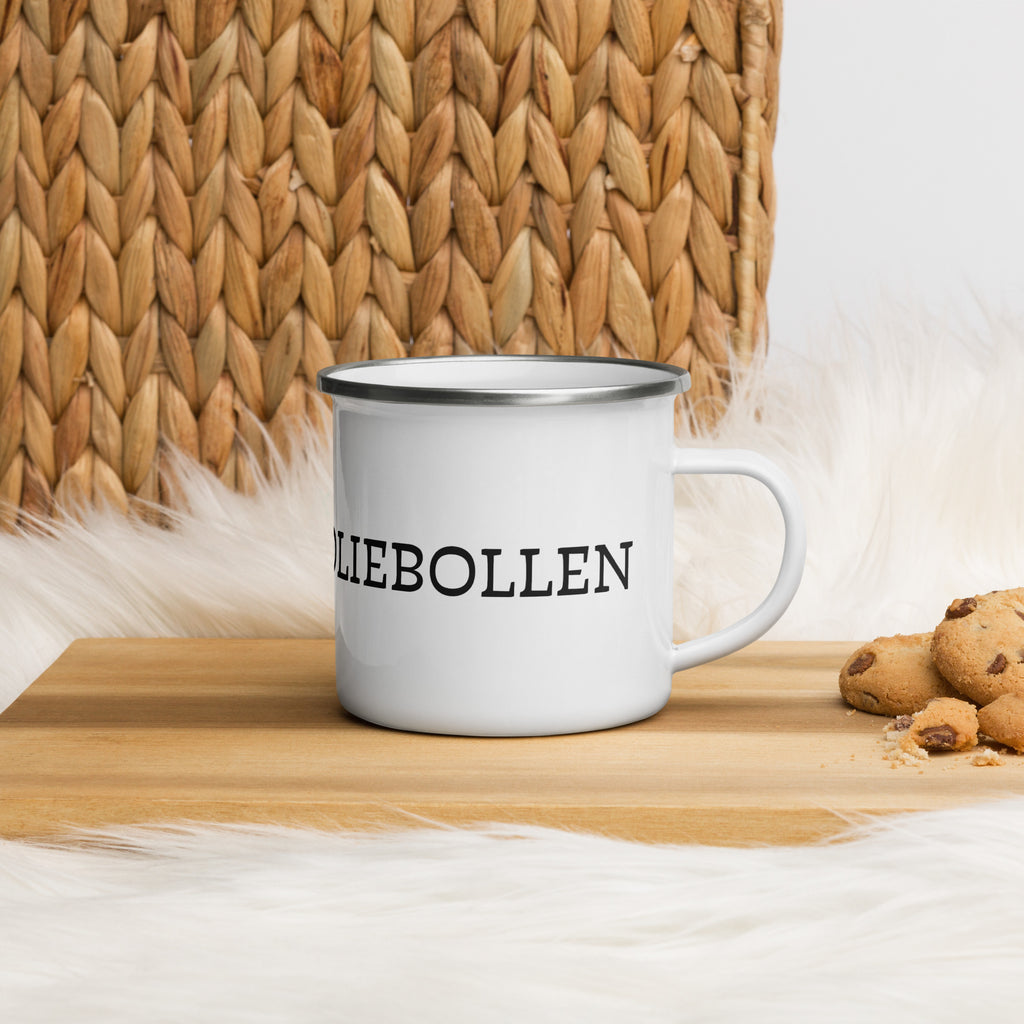 White enamel camping mug with silver rim and wraparound black “Vetkoek > Oliebollen” text, part of the South African Roots collection.