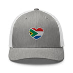 Grey and white mesh-back trucker cap with embroidered Two Homes One Heart design combining the South African and Dutch flags.