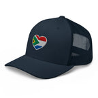 Navy green mesh-back trucker cap with embroidered Two Homes One Heart design combining the South African and Dutch flags.