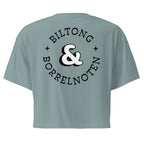 Women’s crop top with a small Two Homes One Heart design combining South African and Dutch flags on the chest and large Biltong & Borrelnoten graphic on the back.