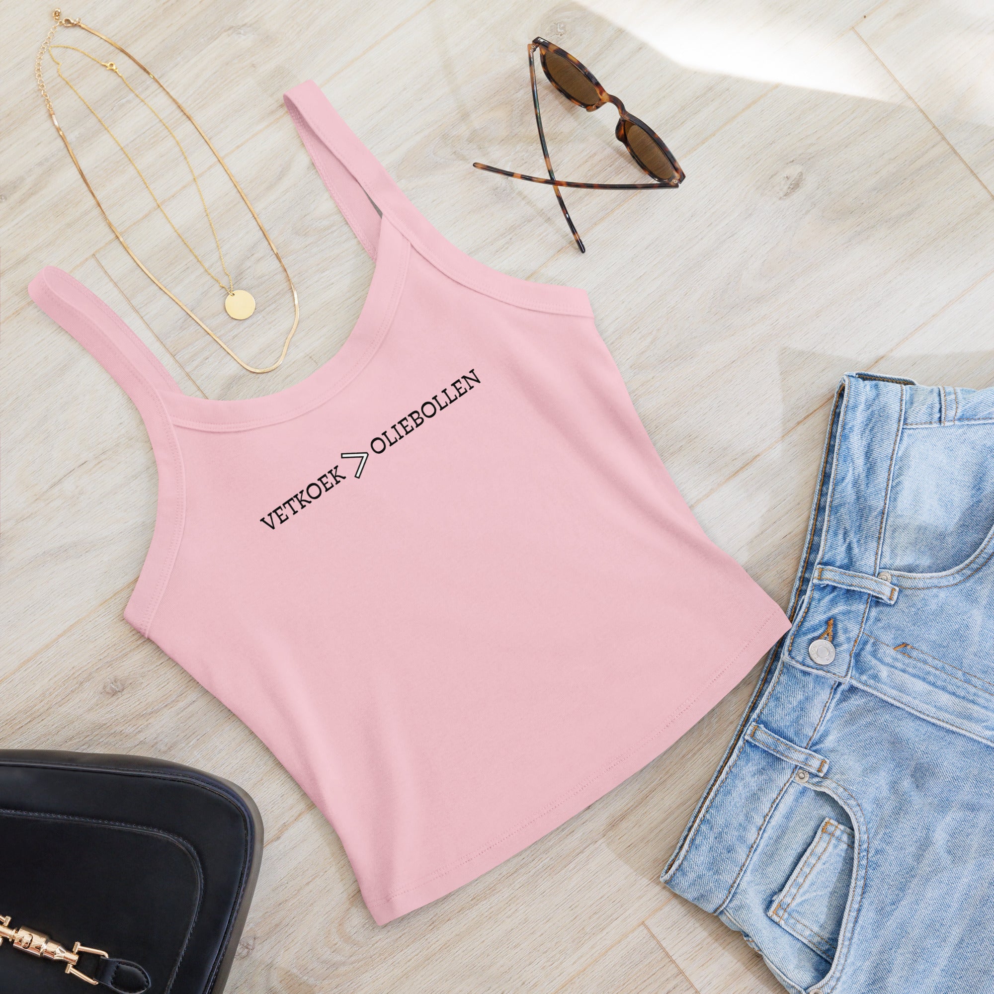 Women’s micro-rib tank top with the text “Vetkoek > Oliebollen” printed across the chest, South African Roots collection top.